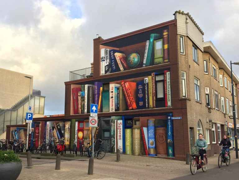 APSOLUTNO, SASVIM, SKROZ GENIJALNO… Ulični umetnik pretvorio fasadu u – policu za knjige