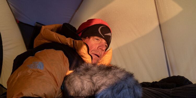 Sound Engineer Jim Hurst at sunrise on the North Col. After battling severe altitude sickness, Hurst decided not to continue on the final push up the mountain. (National Geographic/Renan Ozturk)