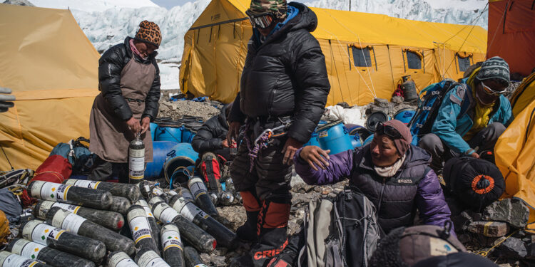 Sherpa team with gear and supplies during expedition to find Sandy Irvine's remains on Mt. Everest. (Photograph by Renan Ozturk, National Geographic)